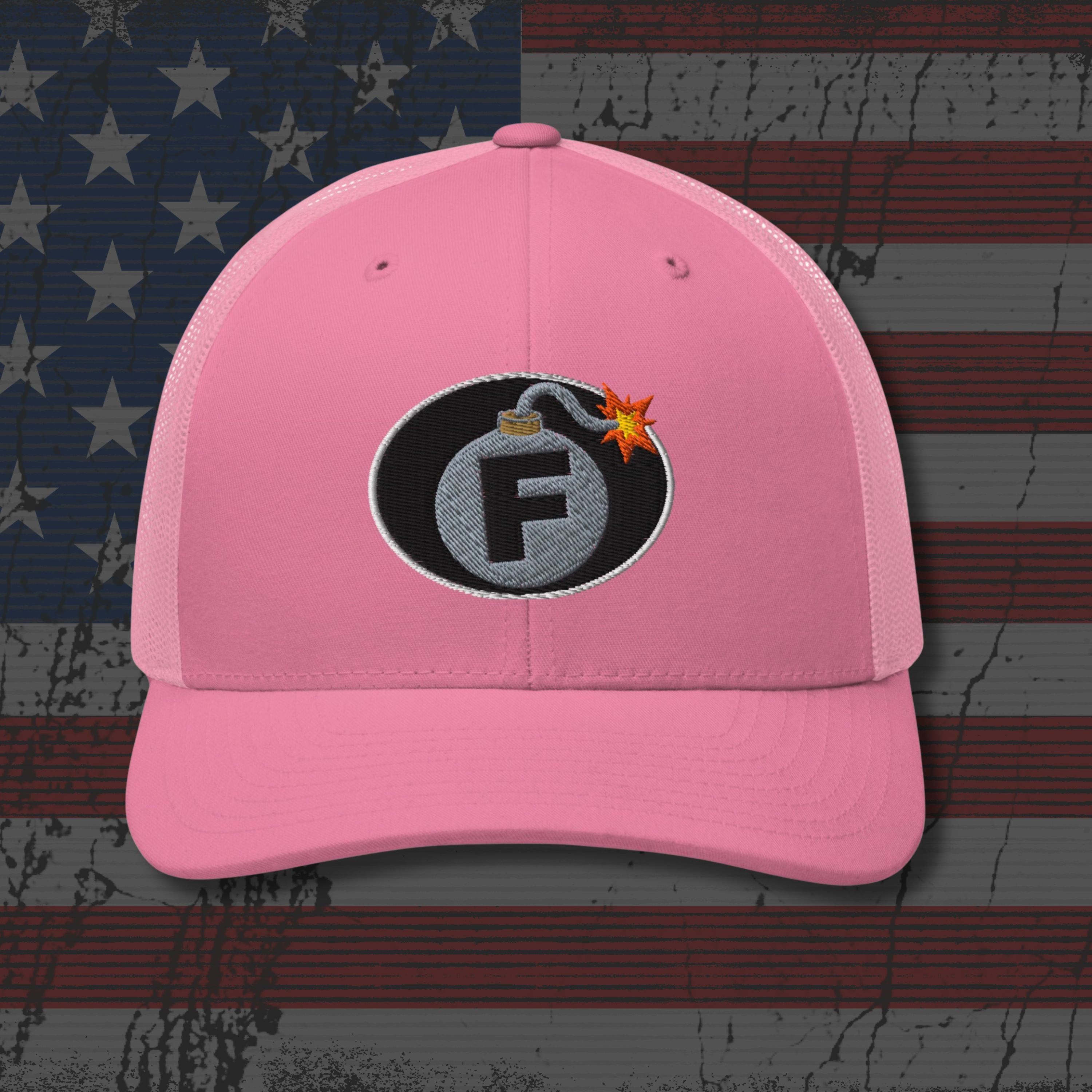 Pink cap with a bomb graphic featuring the letter 'F' on an American flag background