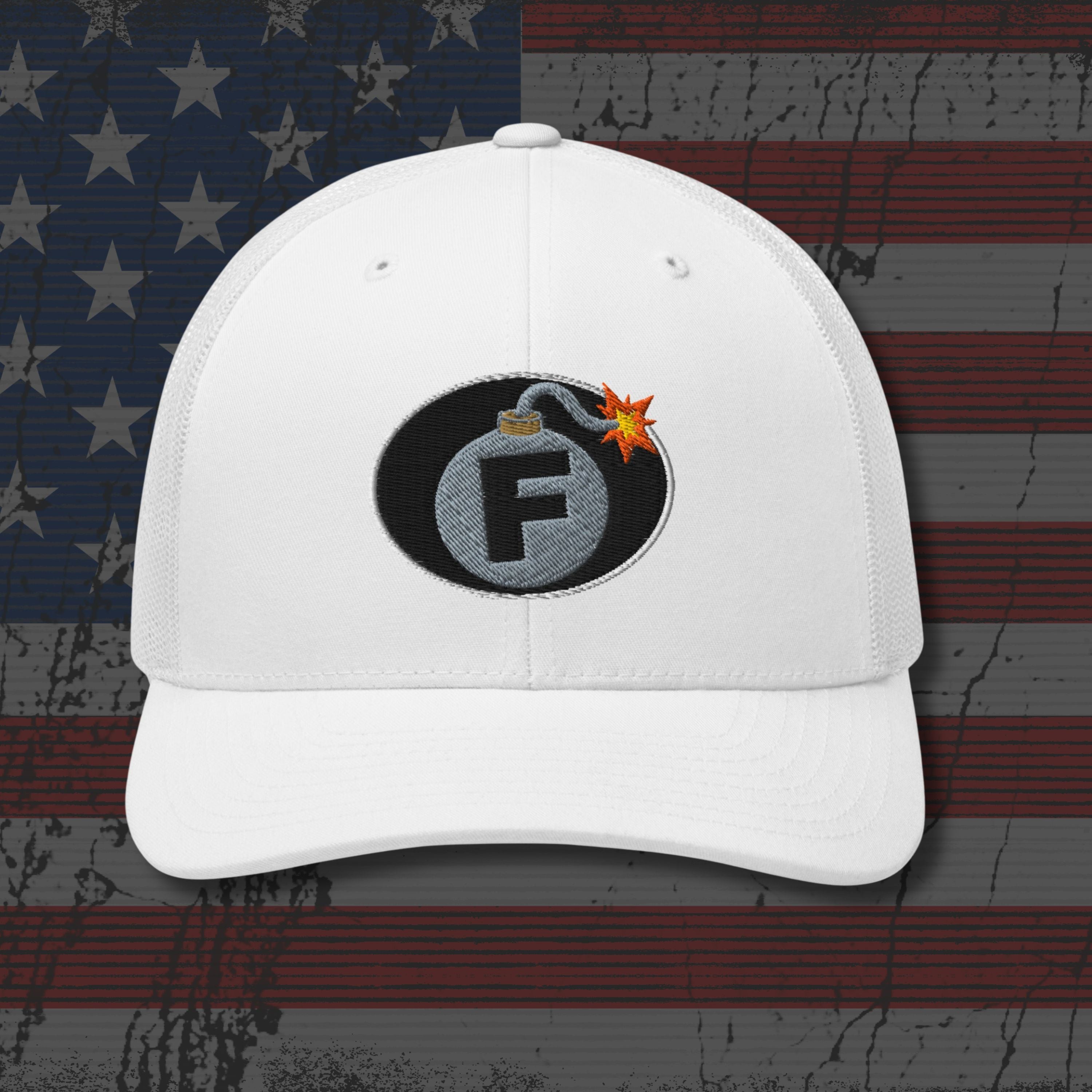 White cap with a bomb graphic featuring the letter 'F' on an American flag background