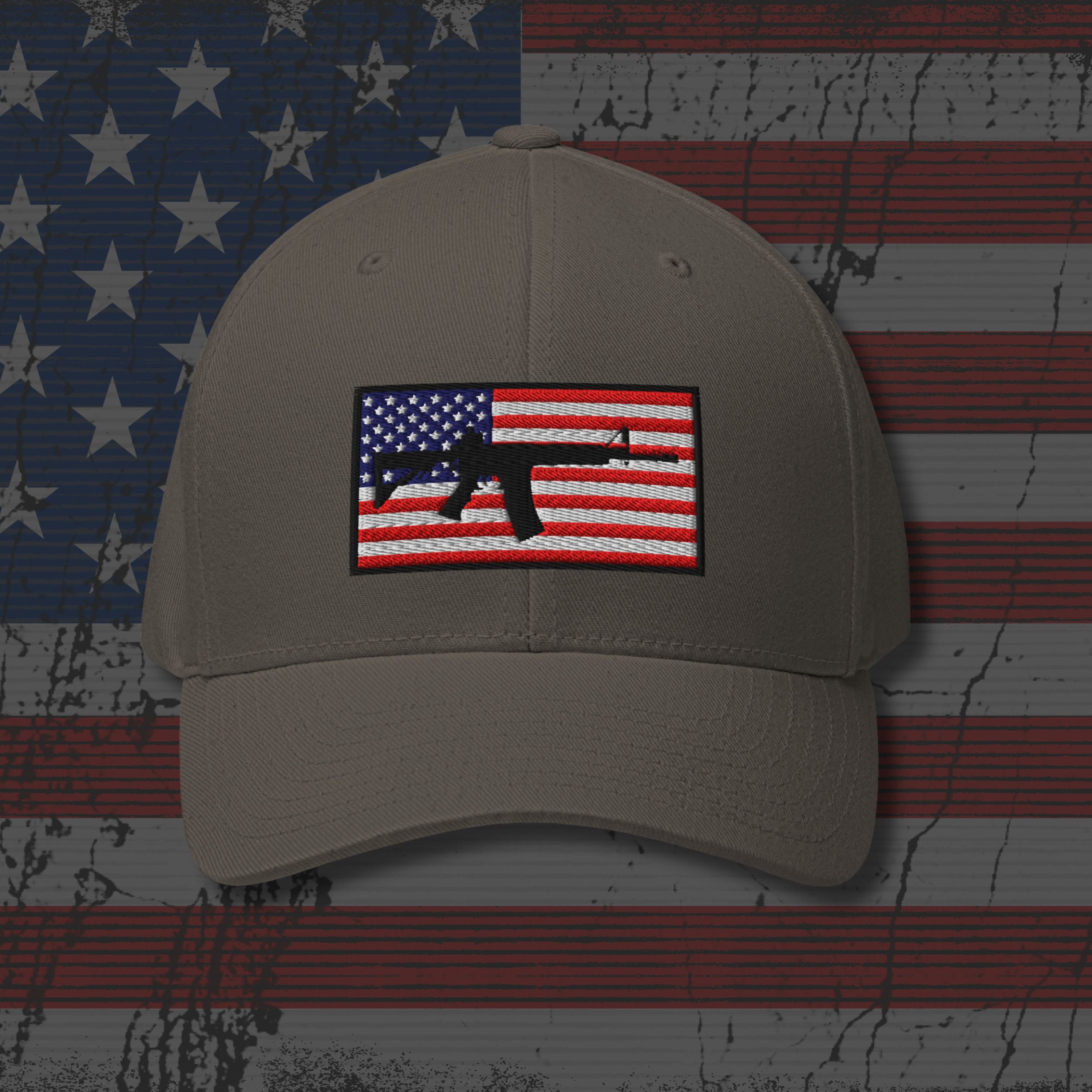 Beige cap with American flag and rifle patch on a distressed American flag background