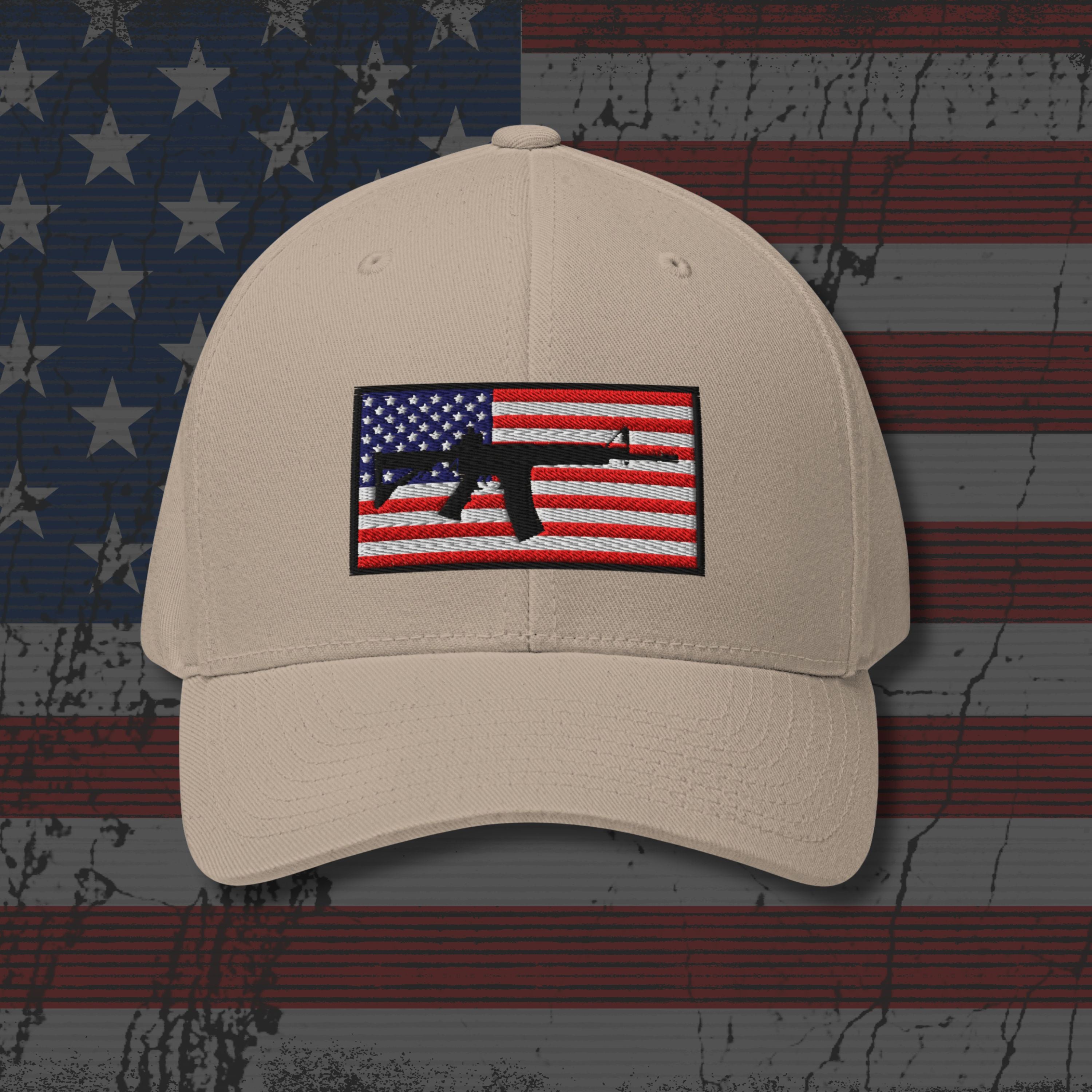 Beige cap with American flag and gun emblem on a distressed American flag background