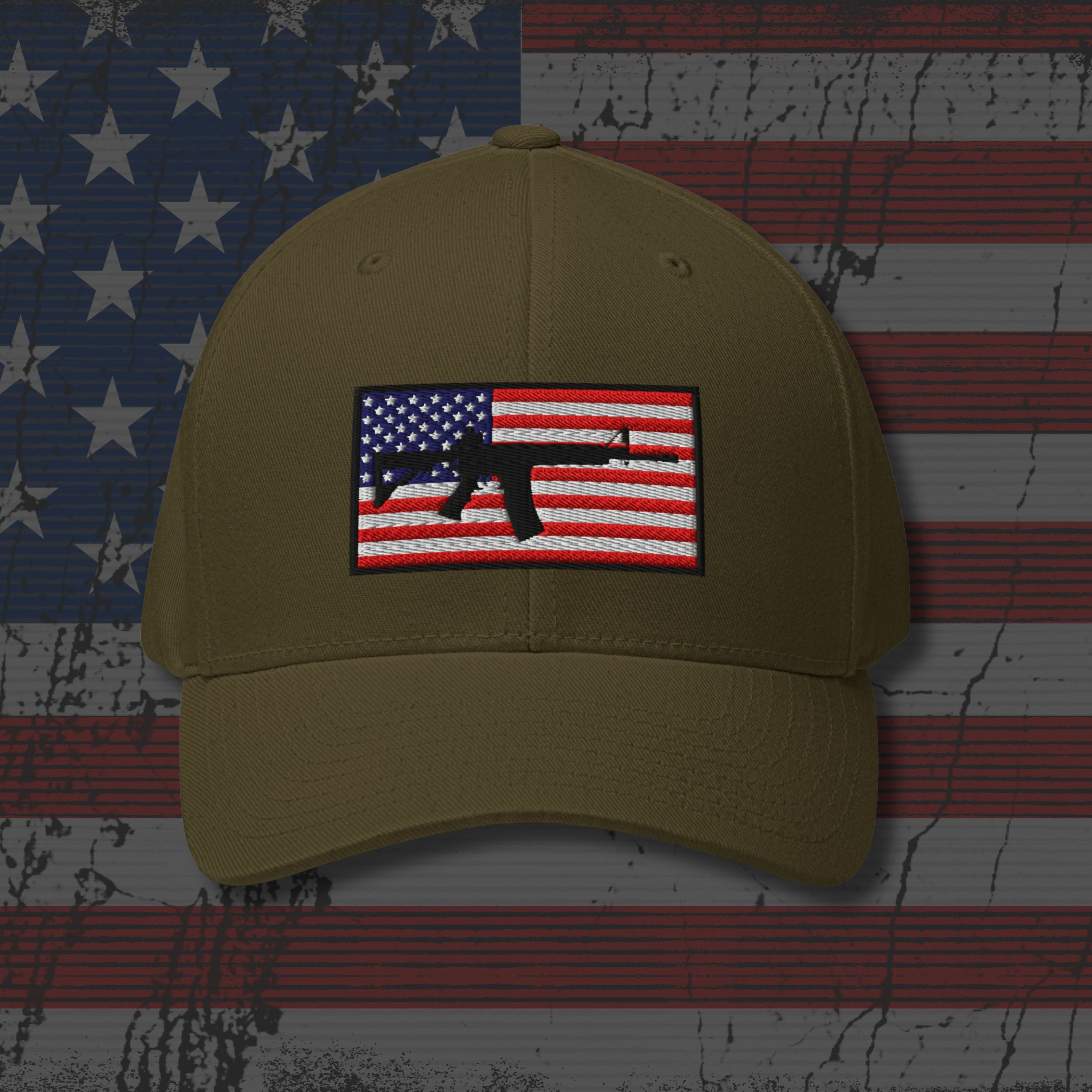 Khaki cap with American flag and gun patch on a distressed American flag background