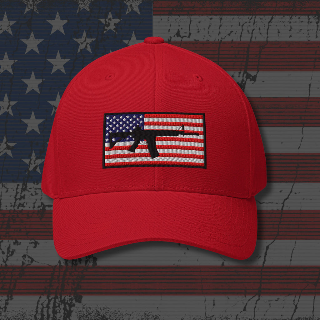 Red cap with an American flag and gun emblem on a distressed American flag background