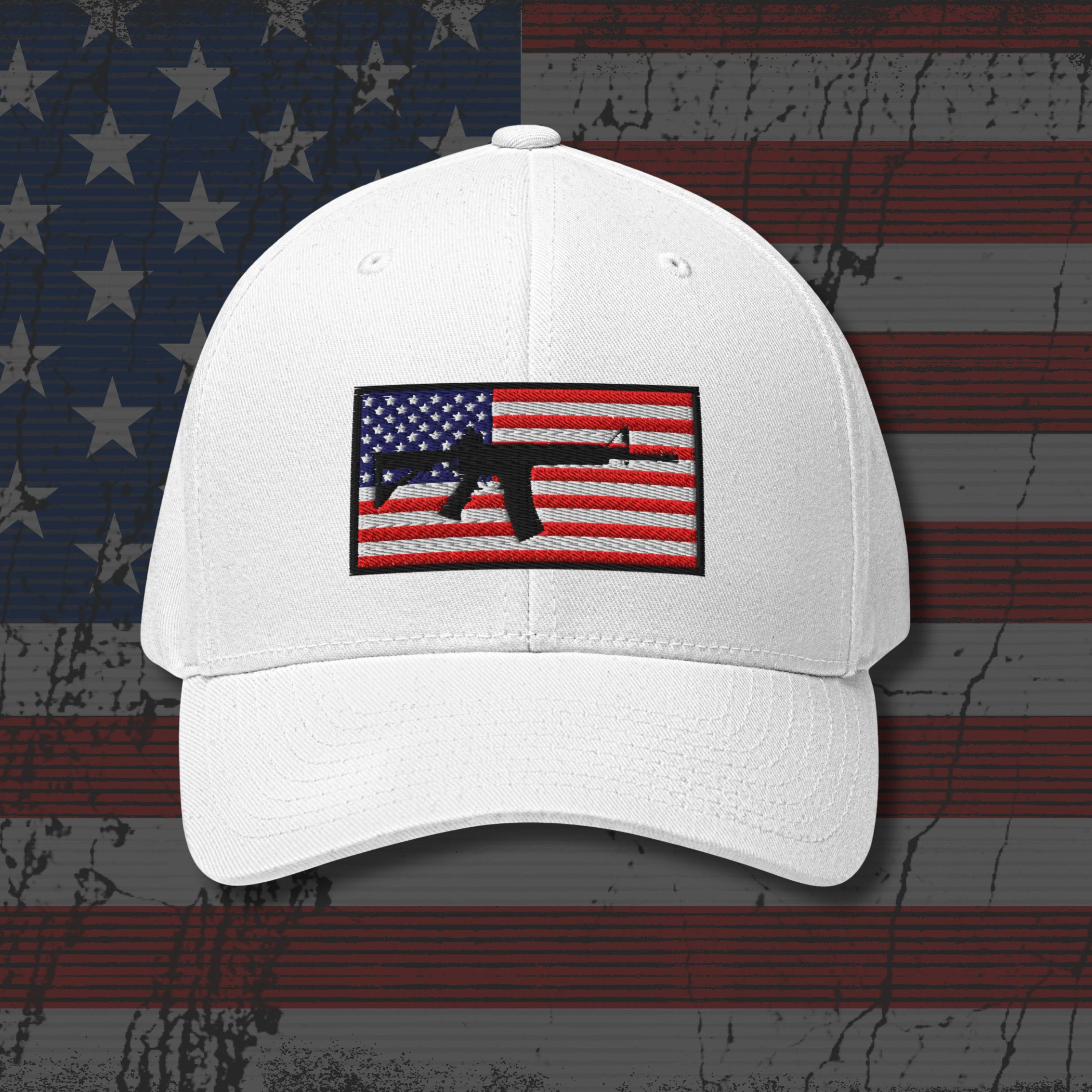 White cap with American flag and gun emblem on a distressed American flag background