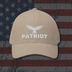 Beige cap with 'Patriot' and eagle logo on an American flag background