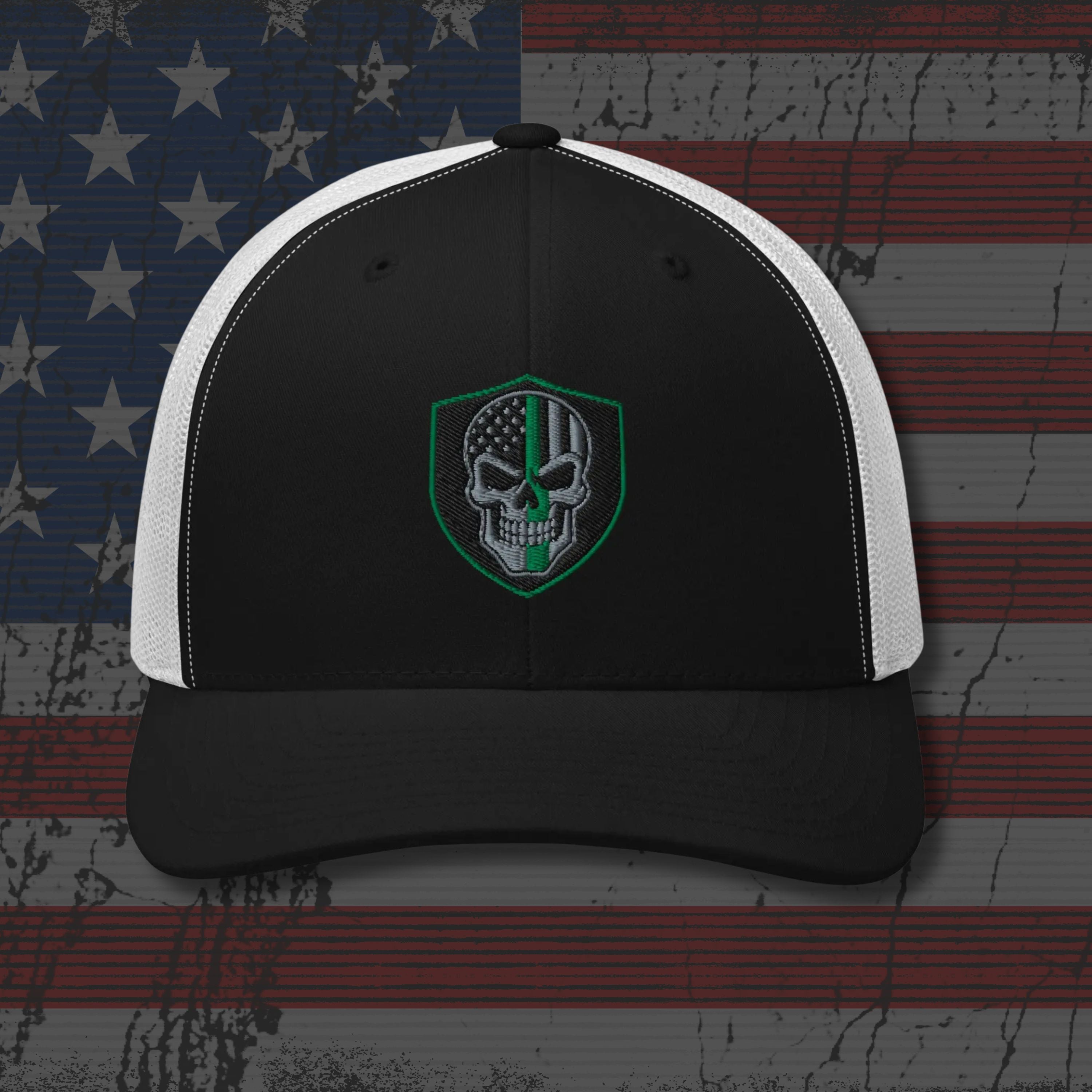 Black and white cap with a skull emblem on an American flag background