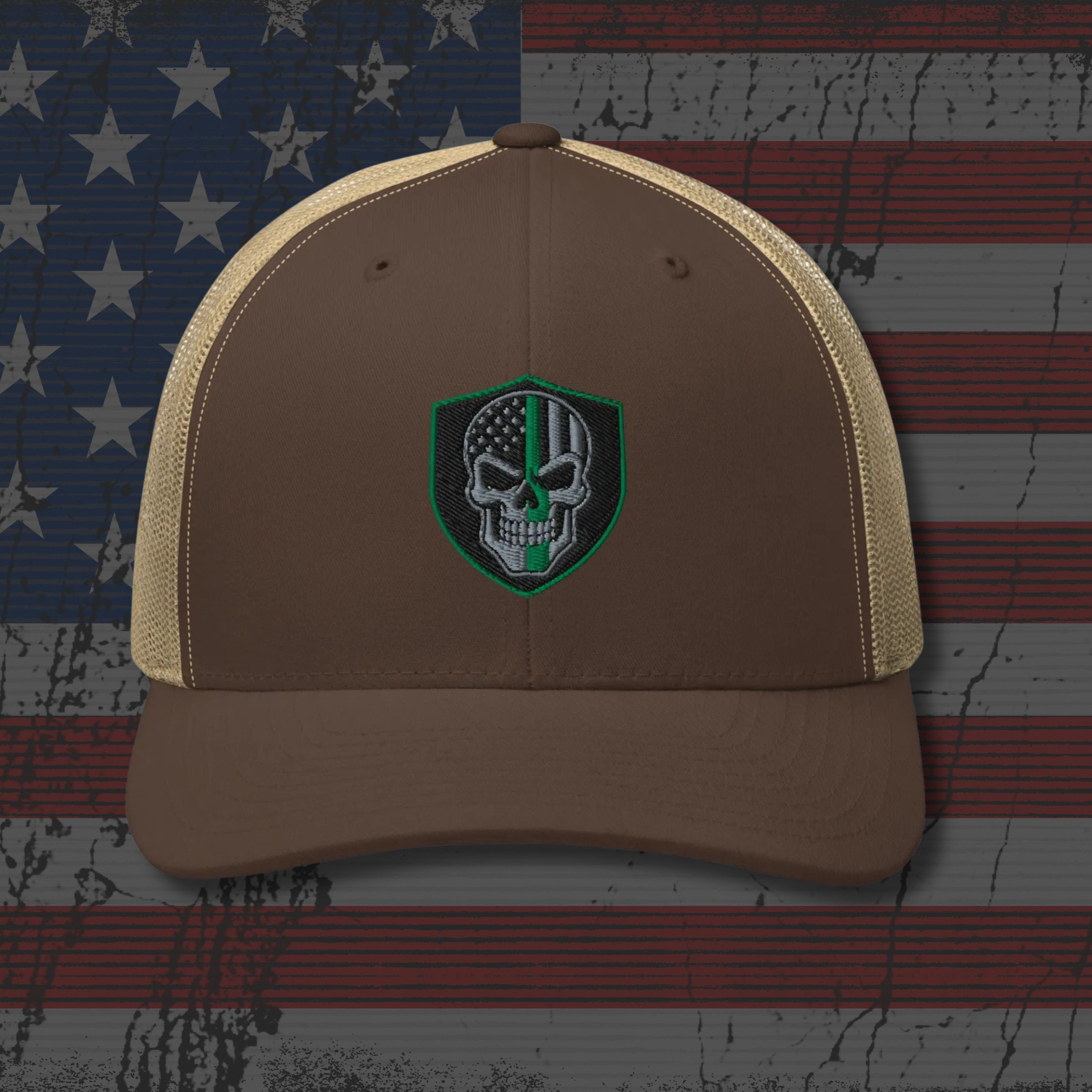 Brown cap with a skull emblem on an American flag background