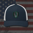 Navy and white cap with a skull emblem on an American flag background