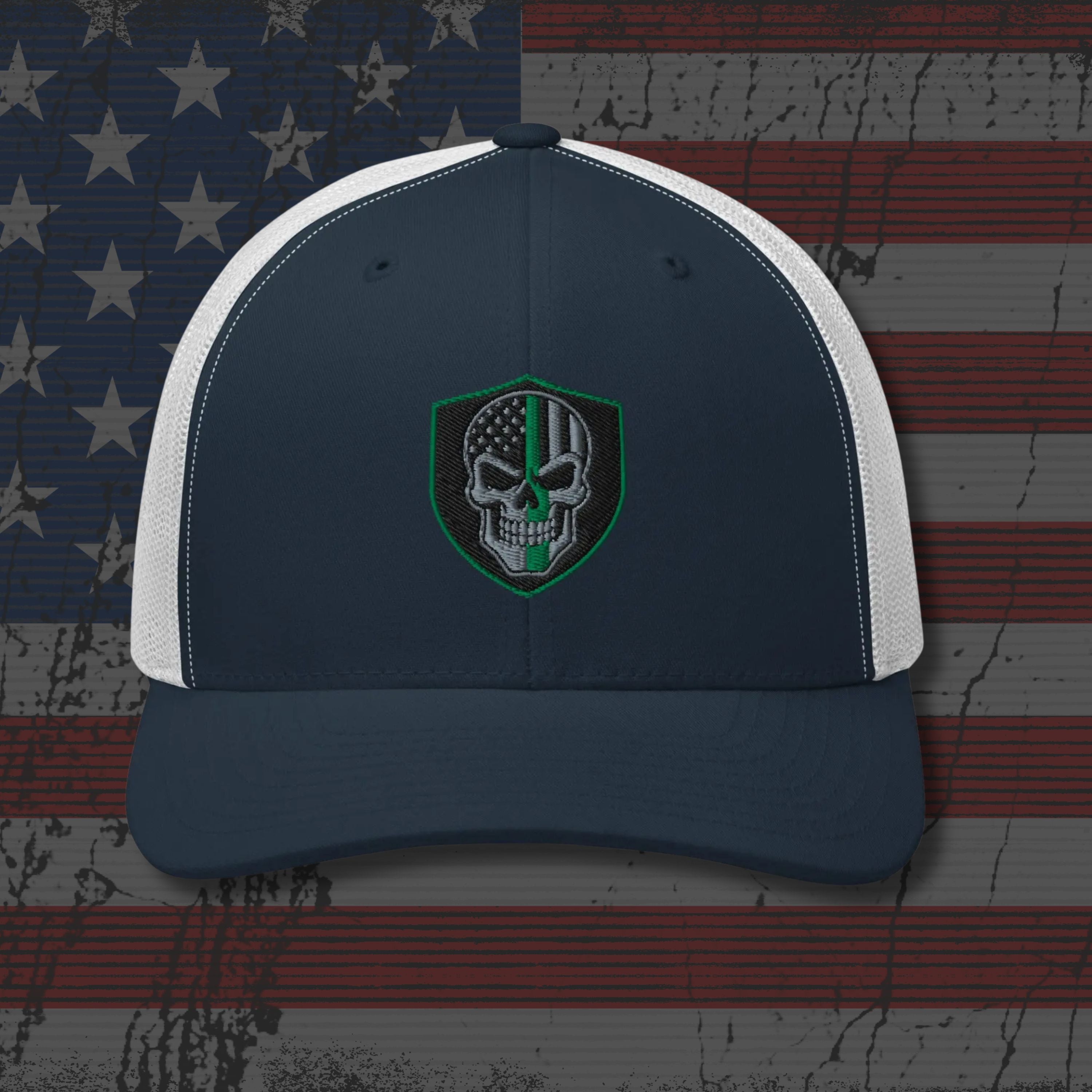 Navy and white cap with a skull emblem on an American flag background
