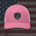 Pink cap with a skull emblem on an American flag background