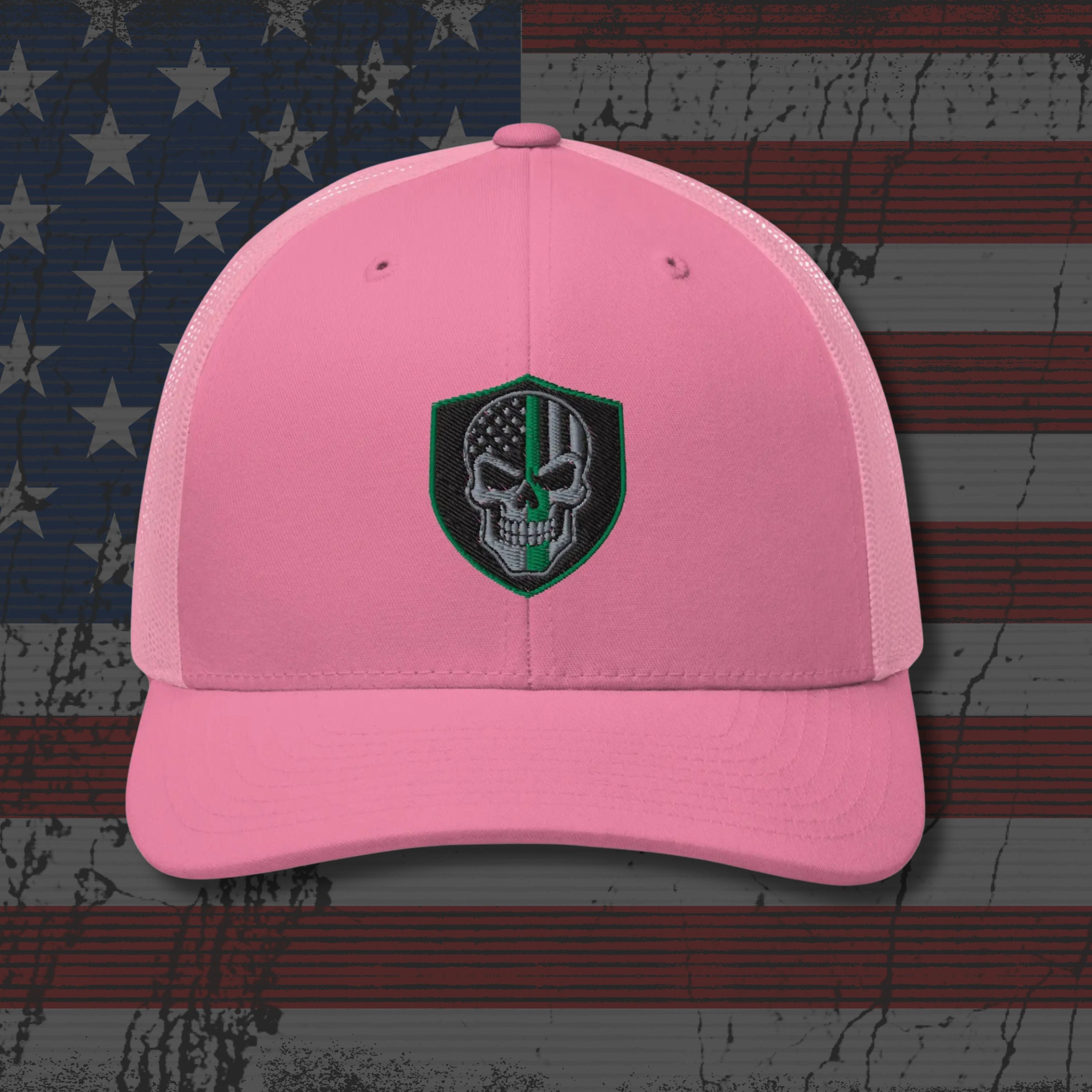 Pink cap with a skull emblem on an American flag background