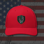 Red cap with a skull emblem on an American flag background