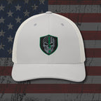 White cap with a skull emblem on an American flag background