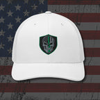White cap with a green and black emblem on an American flag background