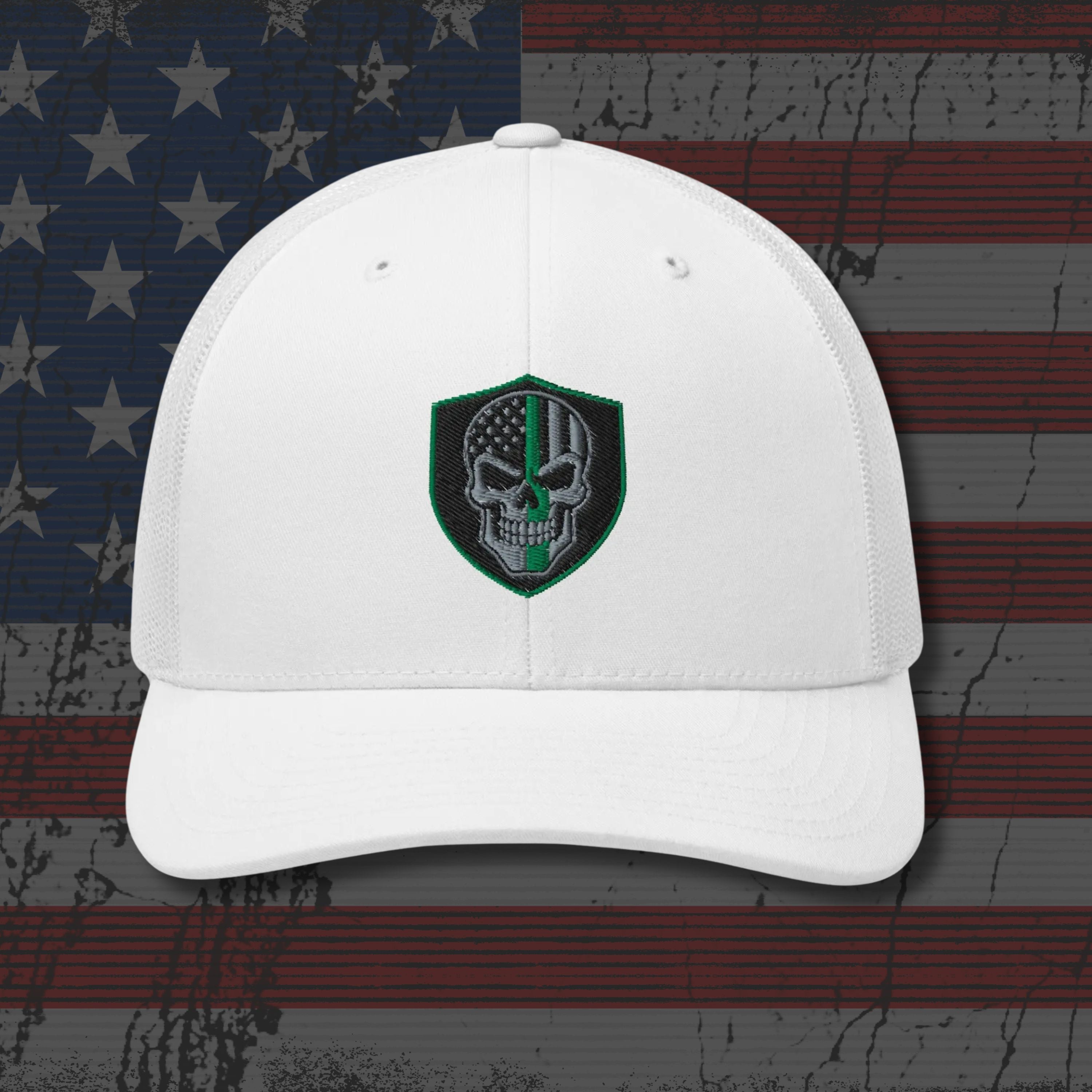 White cap with a green and black emblem on an American flag background