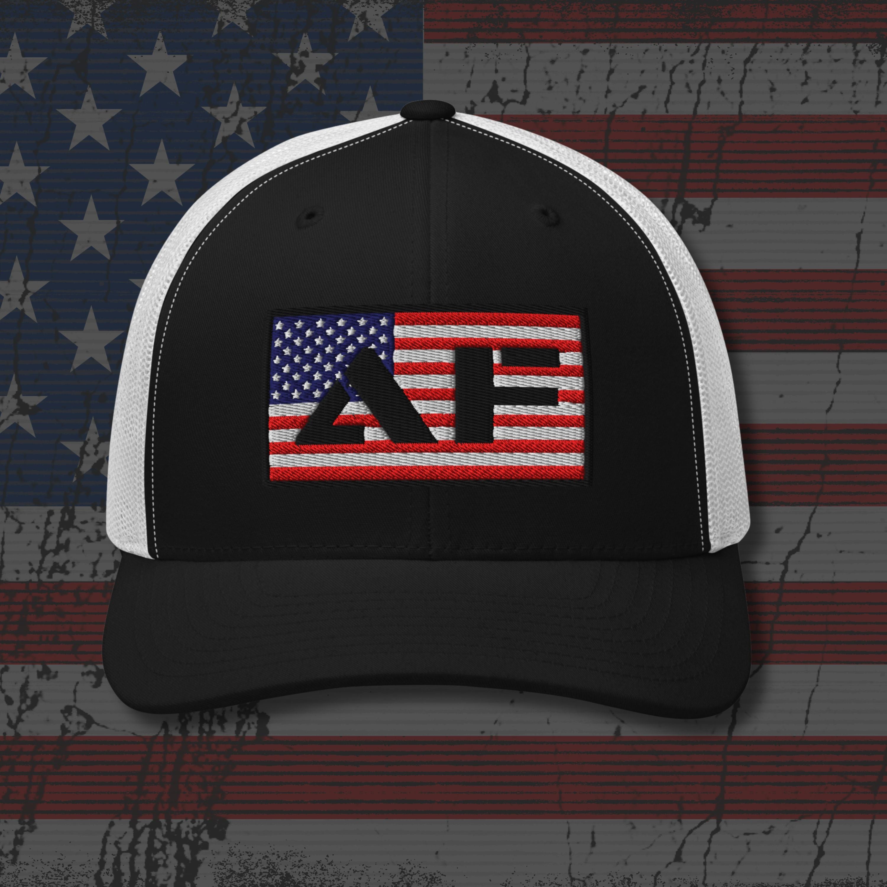 Black and white cap with embroidered design on an American flag background