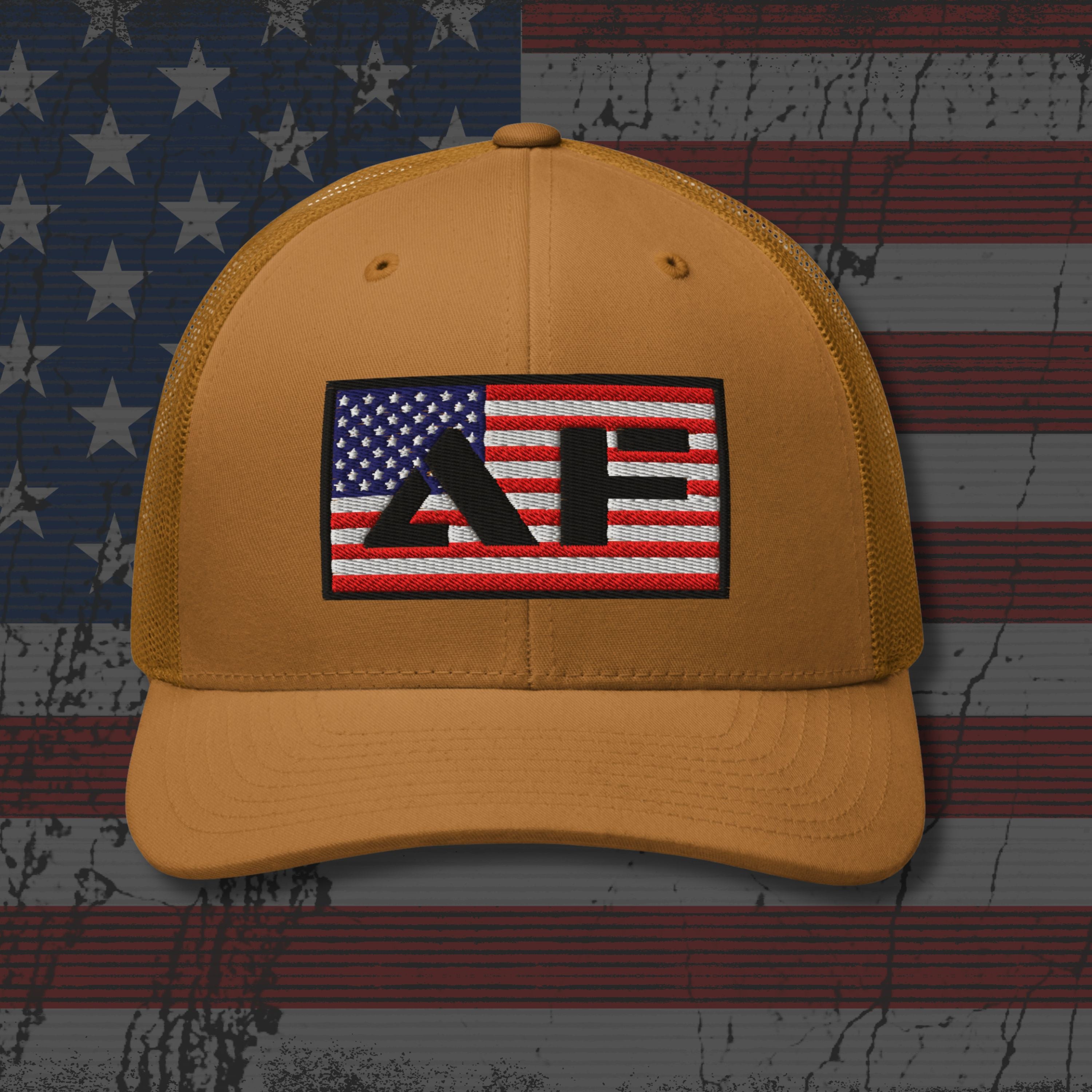 Yellow cap with a logo on an American flag background