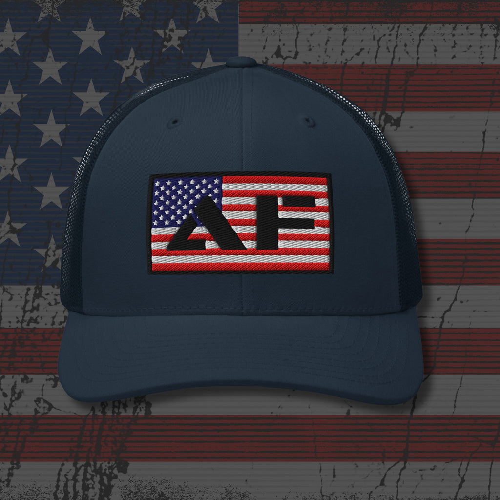 Navy blue cap with a red, white, and blue logo on an American flag background