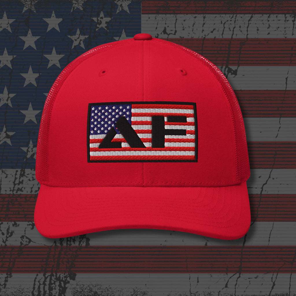 Red cap with a logo on an American flag background