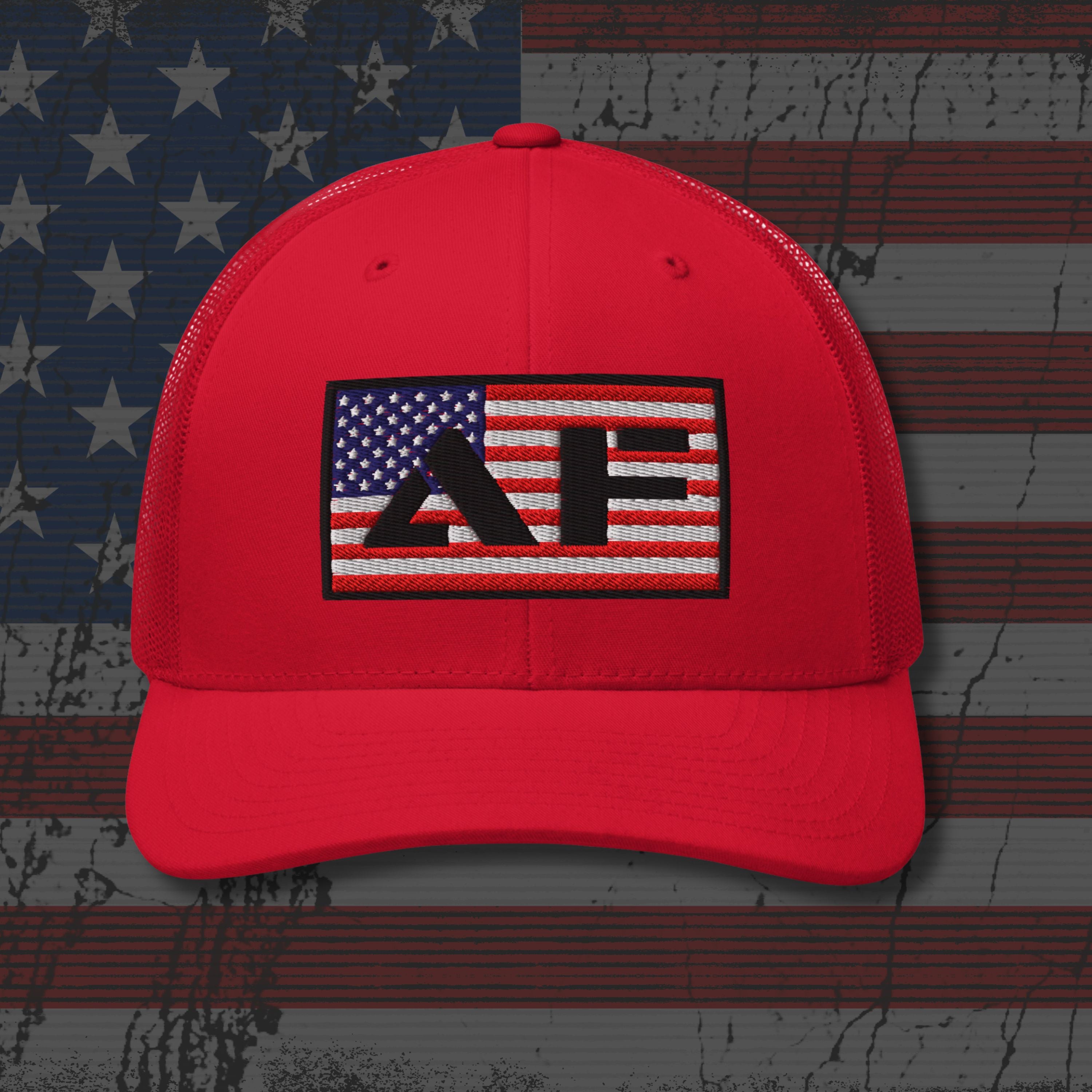 Red cap with a logo on an American flag background