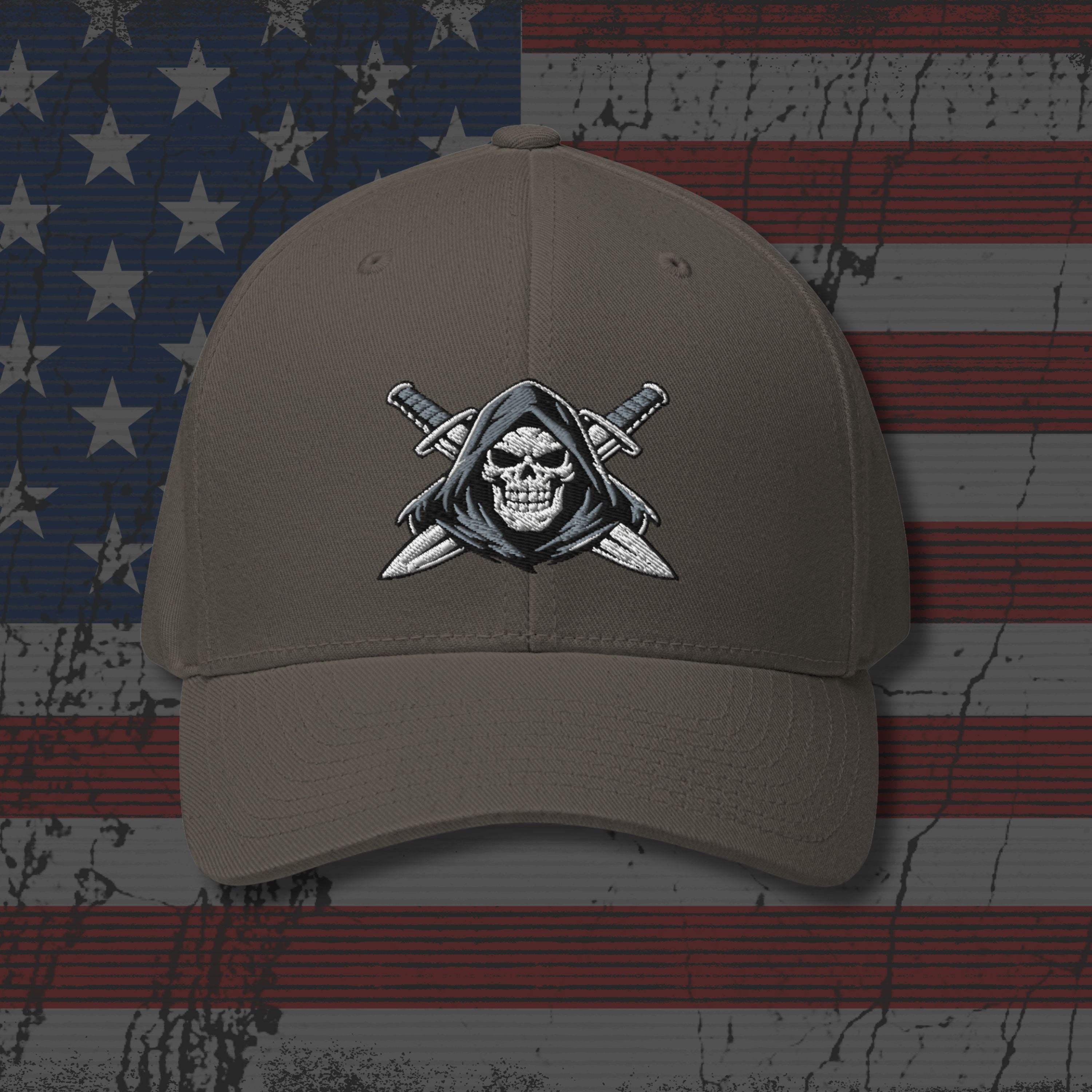 Brown cap with skull and crossed swords emblem on an American flag background