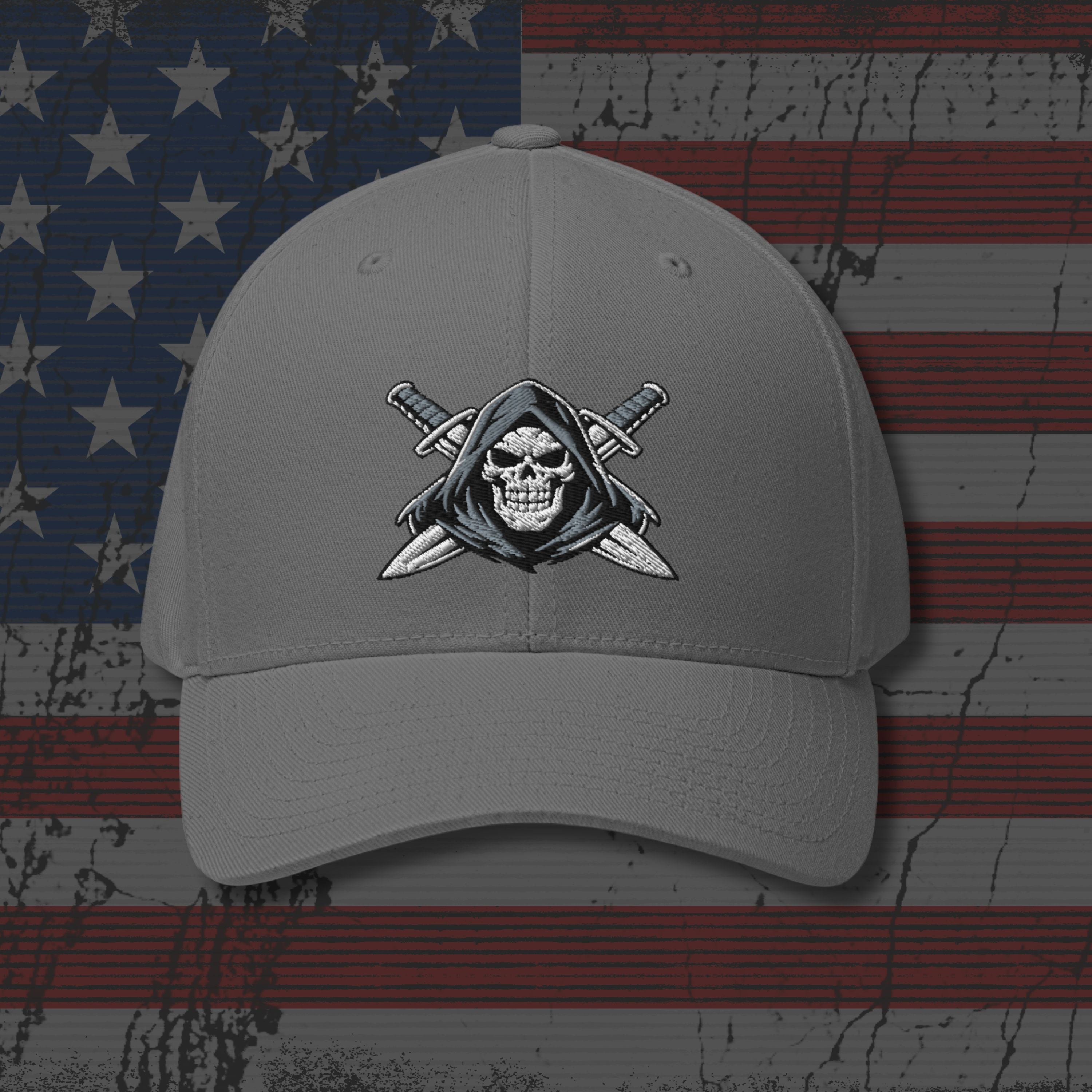 Gray cap with skull and crossed swords emblem on an American flag background