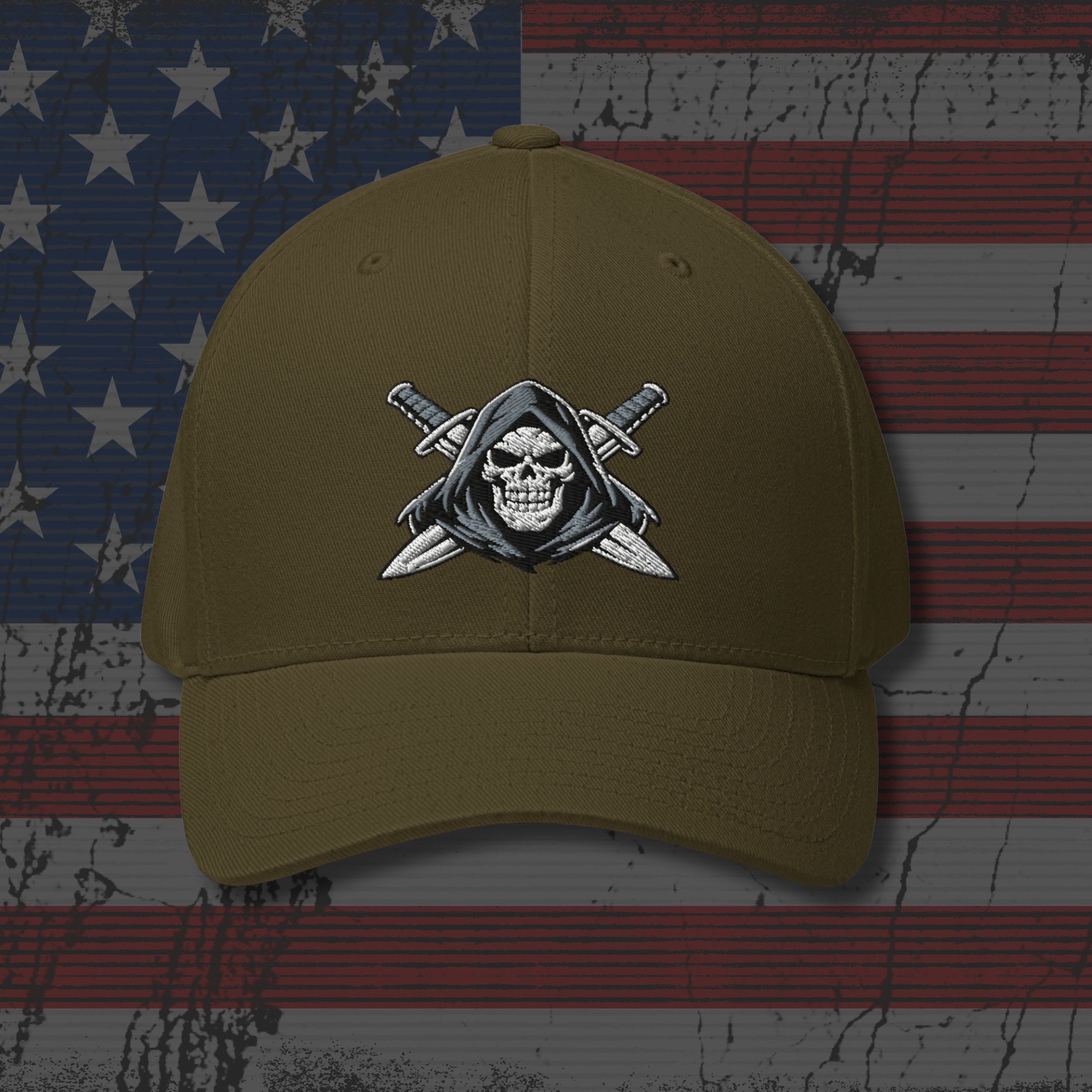 Brown cap with skull and crossed swords emblem on an American flag background