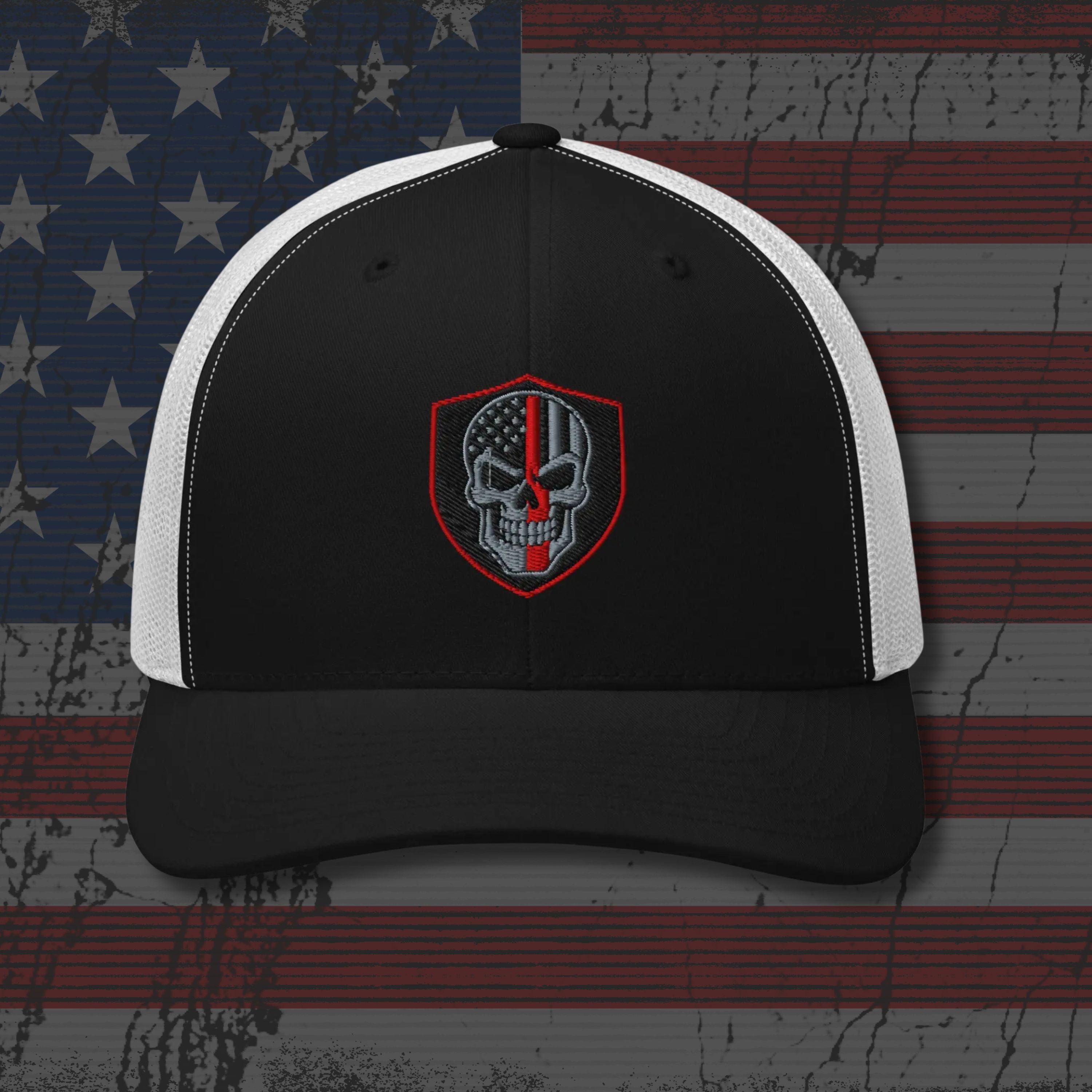 Black and white cap with a skull emblem on an American flag background