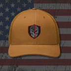Yellow cap with a skull emblem on an American flag background
