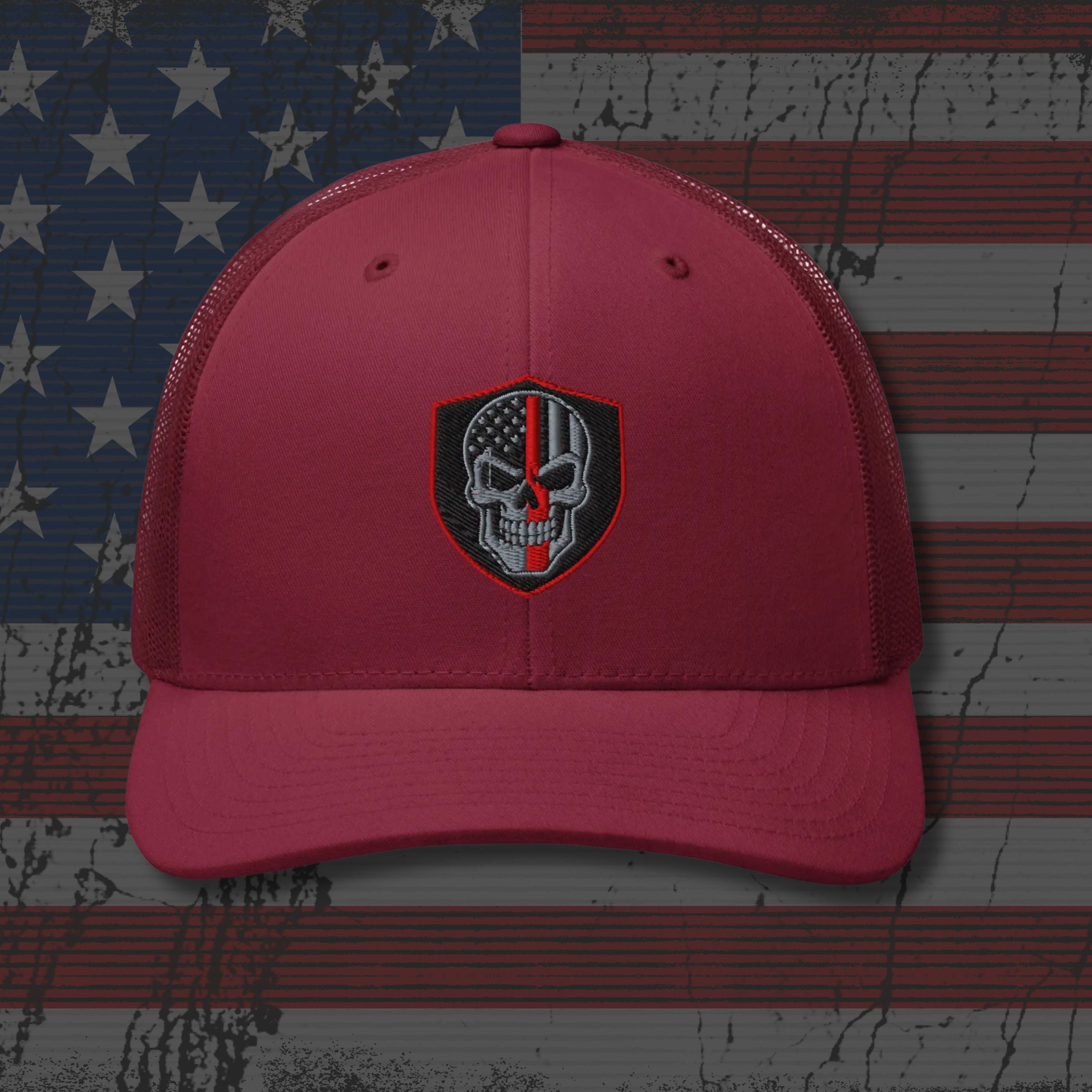 Red cap with a skull emblem on an American flag background