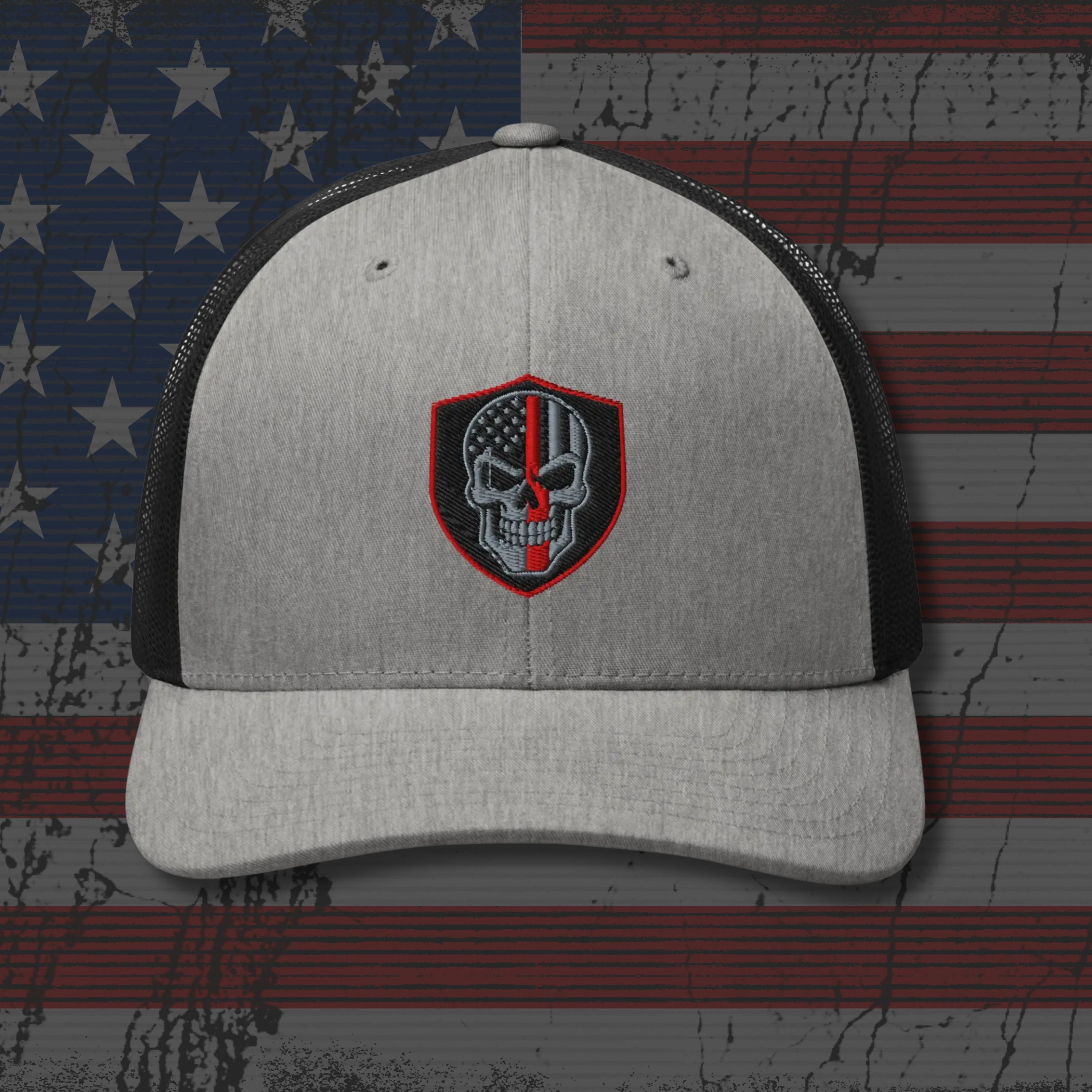Gray and black cap with a skull emblem on an American flag background