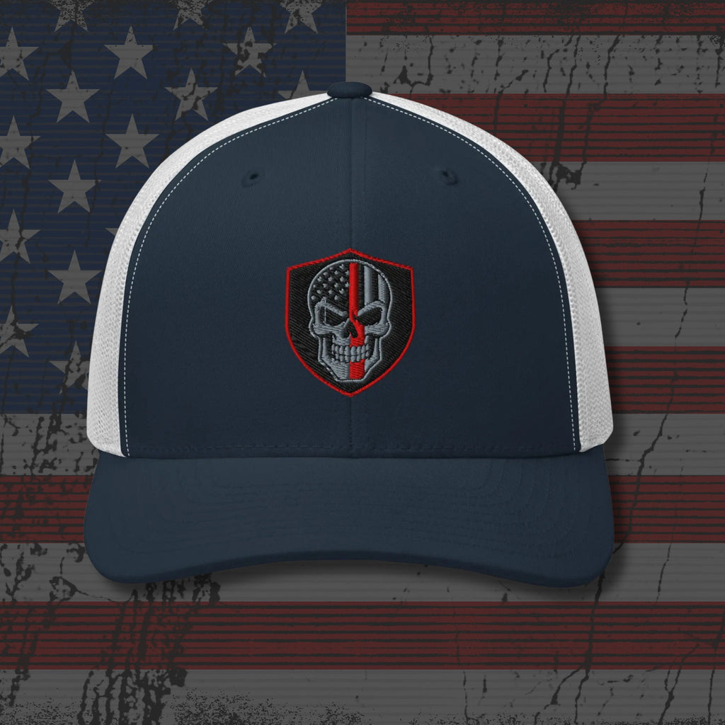 Navy and white cap with a skull emblem on an American flag background