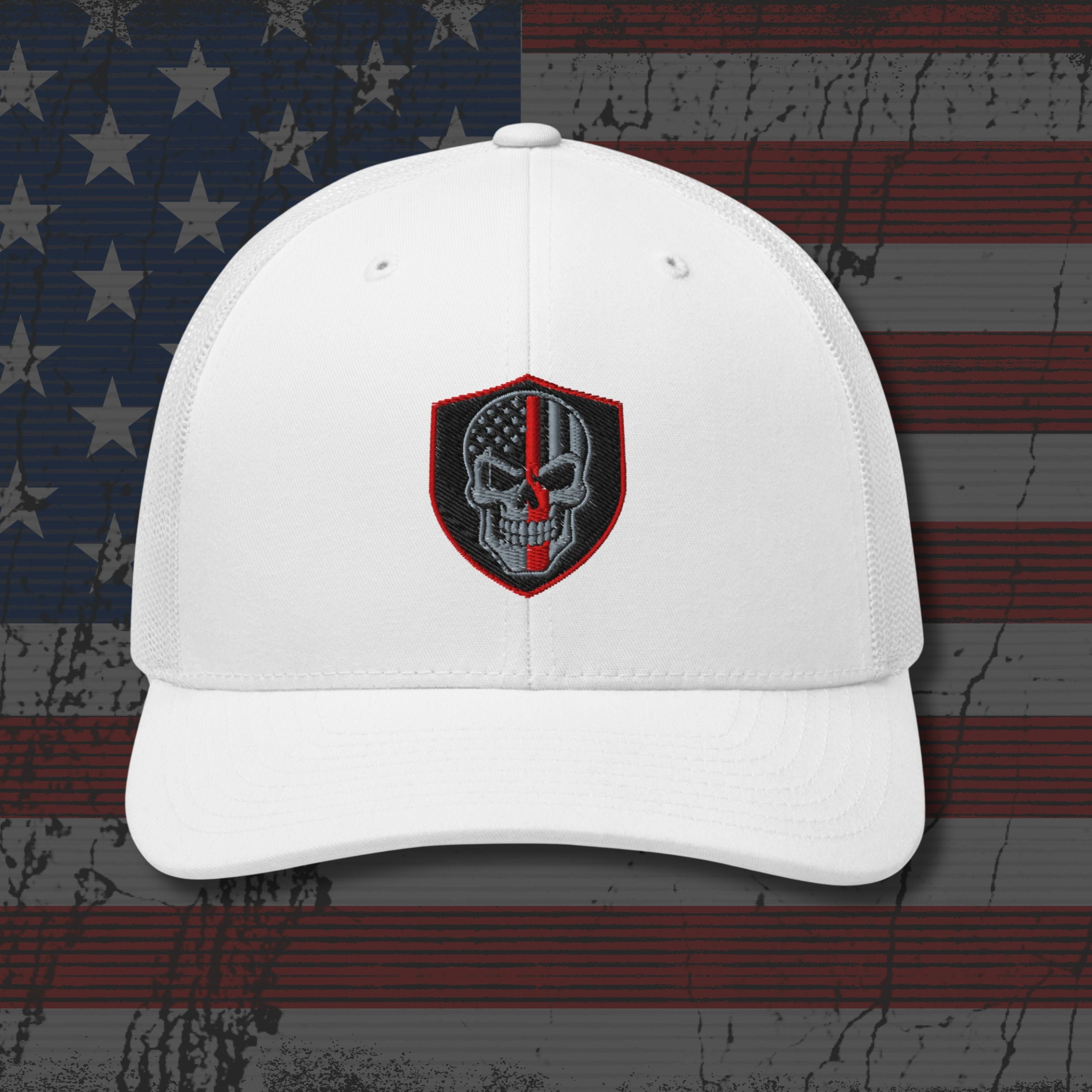 White cap with a skull emblem on an American flag background