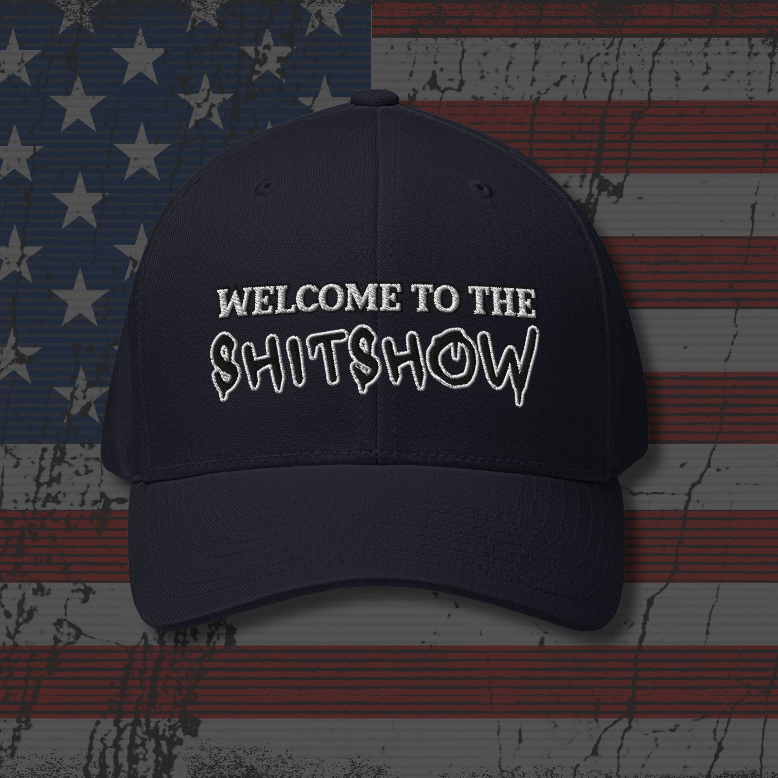 Black cap with 'WELCOME TO THE SHITSHOW' text on an American flag background