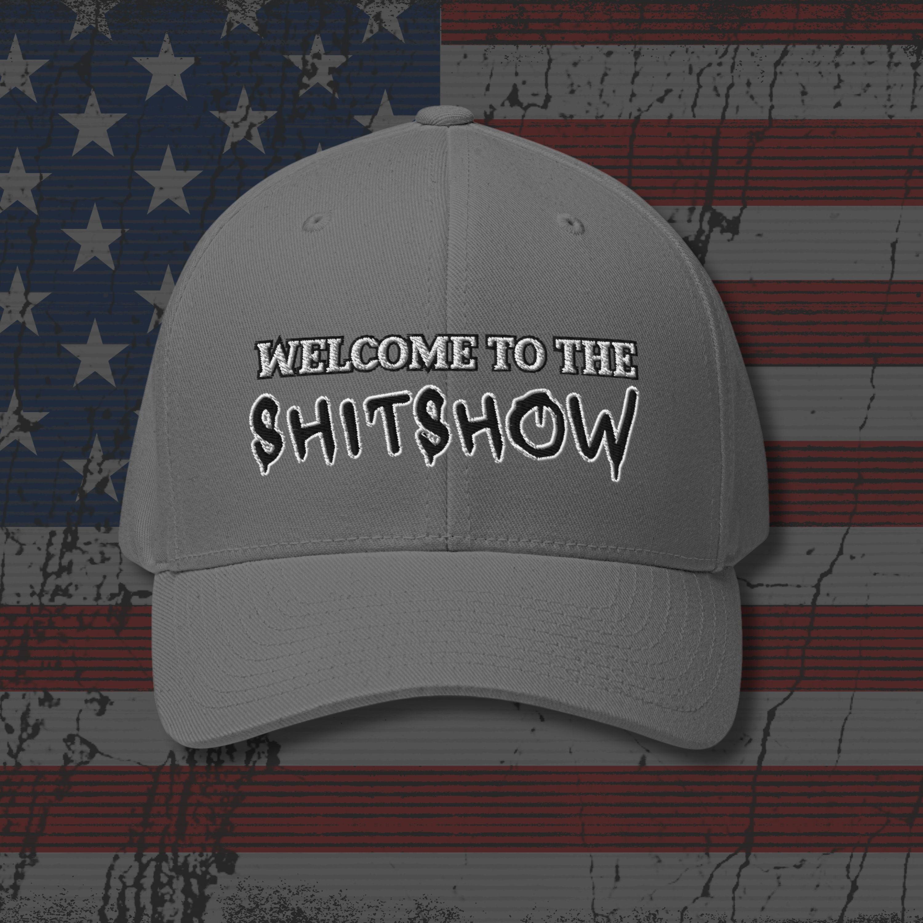 Gray cap with 'WELCOME TO THE SHITSHOW' text on an American flag background