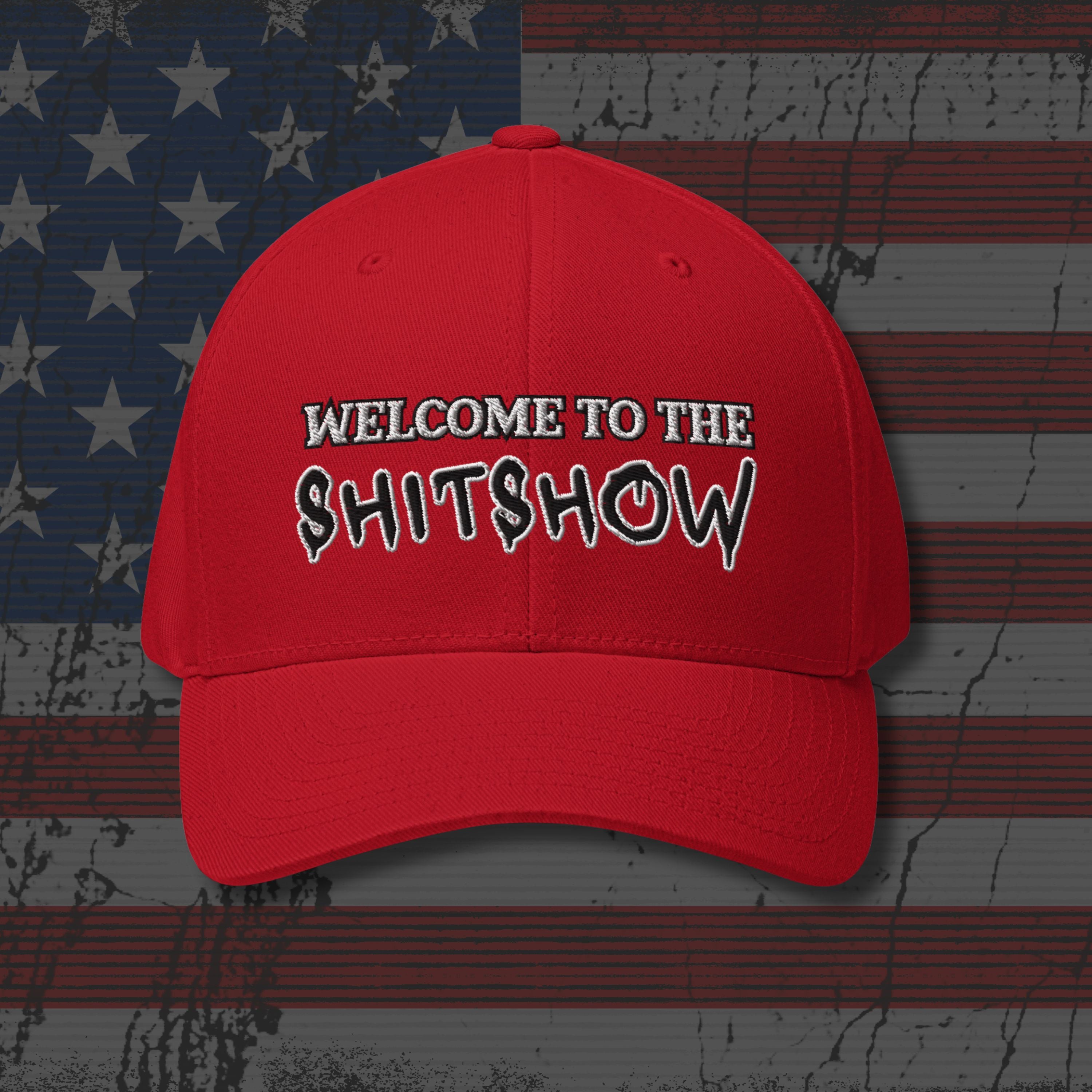 Red cap with text 'WELCOME TO THE SHITSHOW' on an American flag background