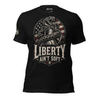 Black tee with front print featuring a rattlesnake wrapped around the Liberty Bell, distressed American flag graphic, and the text Liberty Ain't Soft