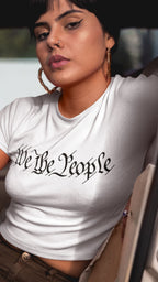 Crop Top  Patriotic Crop Top – We The People Script White Fourth of July Shirt Infidel Collective