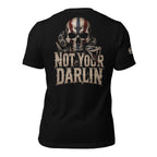 Not Your Darling back print graphic on black tee featuring a distressed skull with American flag markings and a coiled rattlesnake