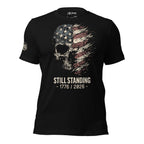 Still Standing 1776 2026 skull American flag front print black tee from Infidel Collective