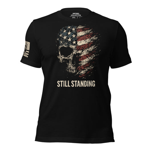 Black t-shirt with American flag skull design and 'STILL STANDING' text on a white background