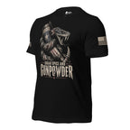 A black short-sleeve t-shirt with a graphic print of a coiled snake holding a revolver and a star-patterned mug, with the text 'SUGAR SPICE AND GUNPOWDER' on the front. The brand name 'INFIDEL COLLECTIVE' is visible on the right sleeve with USA American flag on the right sleeve.