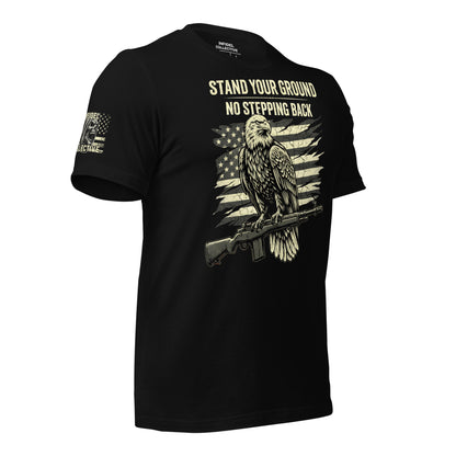 Black t-shirt with an eagle and American flag graphic, text 'Stand Your Ground No Stepping Back' on a white background.