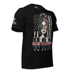 A black short-sleeve graphic t-shirt featuring a stylized woman with an American flag headband and sunglasses, set against a distressed American flag background with 'USA MADE IN AMERICA' text. The brand 'INFIDEL COLLECTIVE' is visible on the right sleeve.