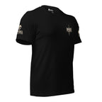Black short-sleeve t-shirt shown from the front, featuring a small distressed graphic of a dagger behind the word 'INFIDEL' with 'BY BLOOD' underneath. A  brand logo INFIDEL COLLECTIVE on the right sleeve. The shirt is displayed against a white background.