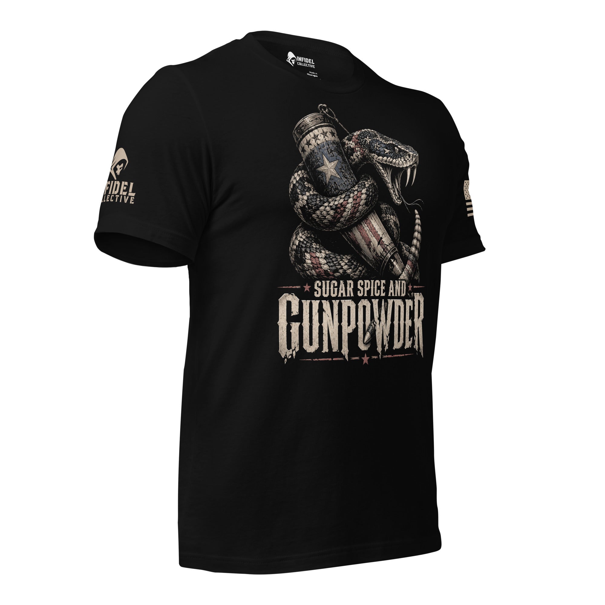 A black short-sleeve t-shirt with a graphic print of a coiled snake holding a revolver and a star-patterned mug, with the text 'SUGAR SPICE AND GUNPOWDER' on the front. The brand name 'INFIDEL COLLECTIVE' is visible on the right sleeve with USA American flag on the right sleeve.