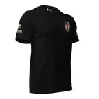 Front right view of black tee with small American flag shield and crimson red cross on the left chest. The left sleeve has an American (USA) flag and the right sleeve brand logo for INFIDEL COLLECTIVE.