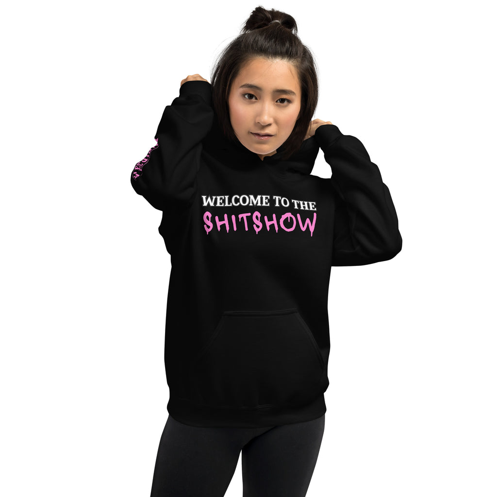 Female wearing a black hoodie with 'Welcome to the Shitshow' text on a distressed white background
